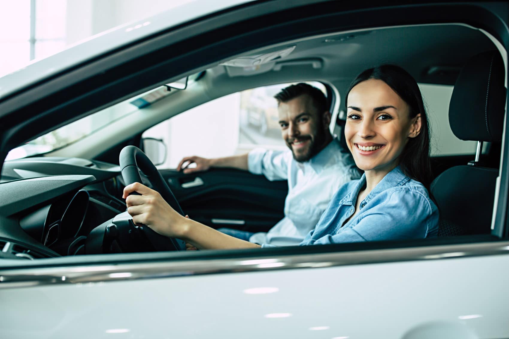 Couple Driving Their New Toyota Vehicle