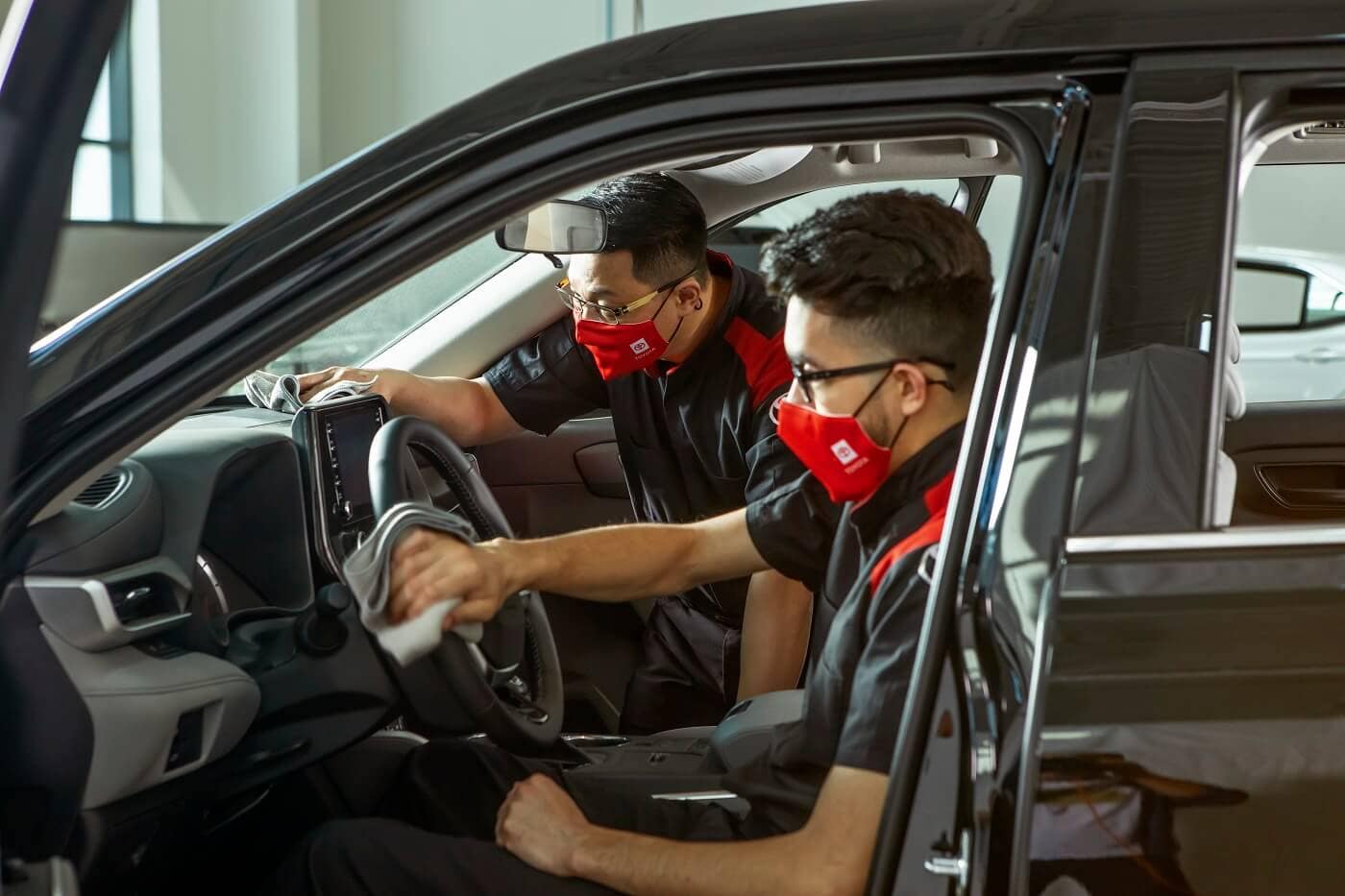 Service Technicians Cleaning a New Toyota